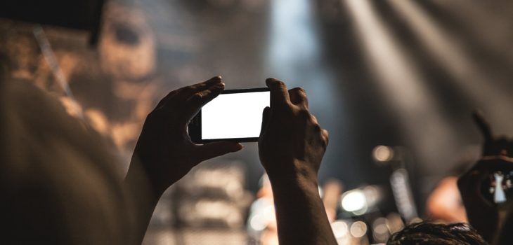mobile phone filming at a gig